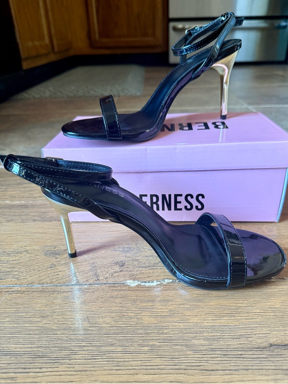Verness Black Patent Leather Ankle-Strap Heels with Gold Stiletto